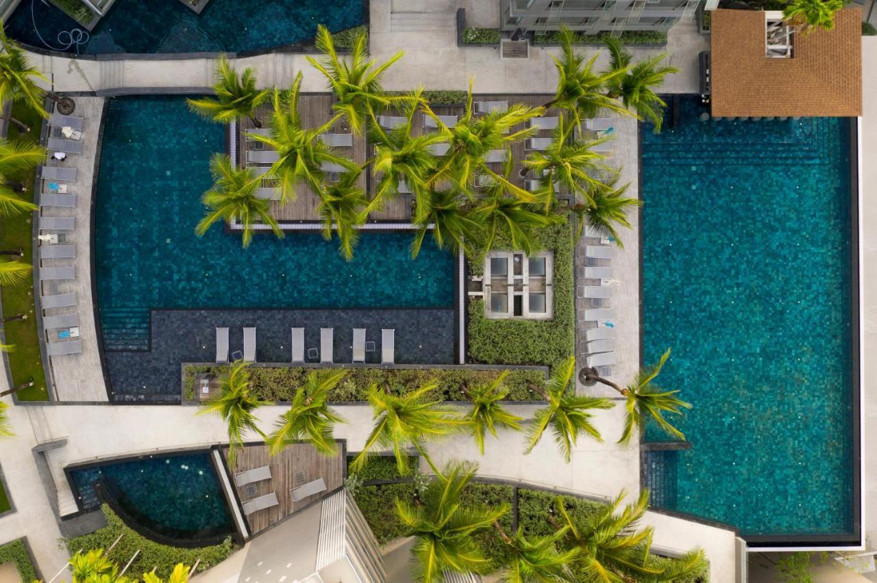 Oceanfront Beach Resort - Sha Extra Plus Patong Экстерьер фото Aerial view of the pool at the hotel