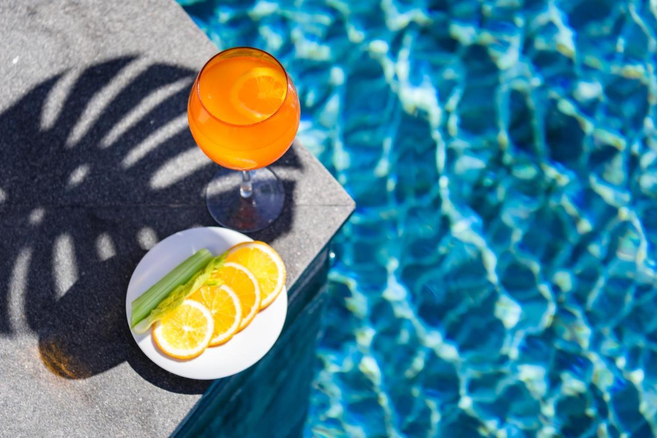 Oceanfront Beach Resort - Sha Extra Plus Patong Экстерьер фото A glass of Aperol Spritz
